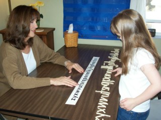 facilitator working with young girl