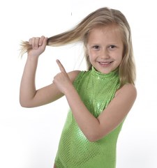 girl pointing to hair