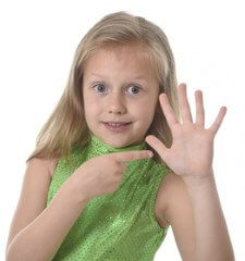 girl pointing to her hand