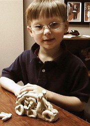 boy with clay model